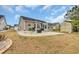 This backyard features a patio with a grill, chairs and a small storage shed at 224 Cupola Dr., Longs, SC 29568