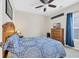 Cozy bedroom features ceiling fan, dresser with TV, and comfortable bedding at 224 Cupola Dr., Longs, SC 29568