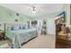 Spacious bedroom featuring green walls, ceiling fan, and ensuite bathroom access at 224 Cupola Dr., Longs, SC 29568
