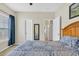 This bedroom showcases a bright window, neutral walls and a decorative wooden headboard at 224 Cupola Dr., Longs, SC 29568