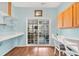 Bonus room with sliding glass doors leading to an outdoor living space, and a desk and chair at 224 Cupola Dr., Longs, SC 29568