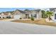 Charming single-story home featuring a well-manicured lawn, tidy landscaping, and an attached two-car garage at 224 Cupola Dr., Longs, SC 29568