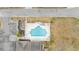 Aerial view of a community pool with lounge chairs and sun umbrellas at 224 Cupola Dr., Longs, SC 29568