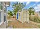 Backyard shed with double doors offers additional storage space at 224 Cupola Dr., Longs, SC 29568