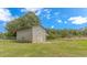 Exterior view of barn on a property with mature trees and lawn at 2360 Highway 701 North, Loris, SC 29569