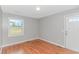 Cozy room with hardwood floors, natural light, and white trim at 2360 Highway 701 North, Loris, SC 29569
