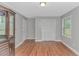 A bedroom features hardwood flooring and a dark wood china cabinet at 2360 Highway 701 North, Loris, SC 29569