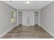 An empty bedroom features wood flooring and two closets at 2360 Highway 701 North, Loris, SC 29569