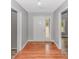 The entryway features hardwood floors and views of the living spaces and sliding closet at 2360 Highway 701 North, Loris, SC 29569