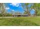 Exterior of home with large yard, covered carport, and blue sky at 2360 Highway 701 North, Loris, SC 29569