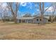 Exterior view of home with mature trees and metal roof at 2360 Highway 701 North, Loris, SC 29569