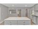 The kitchen island has a marble countertop and gray drawers and cabinets at 2360 Highway 701 North, Loris, SC 29569