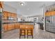 Open kitchen featuring stainless appliances, granite counters, and a kitchen island, seamlessly connects to the living spaces at 2385 Windmill Way, Myrtle Beach, SC 29579
