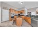 Cozy kitchen features stainless appliances, granite counters, and a convenient island, blending style with functionality at 2385 Windmill Way, Myrtle Beach, SC 29579