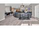 A spacious living room with a pool table, fireplace, TV, and an open layout to the kitchen at 2385 Windmill Way, Myrtle Beach, SC 29579