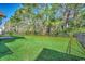 Lush backyard with green grass, partially shaded by mature trees at 2509 Oriole Dr., Murrells Inlet, SC 29576