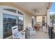 Inviting balcony with rocking chairs, outdoor seating, and stunning views of the waterfront and horizon at 265 Venice Way # 1-201, Myrtle Beach, SC 29577