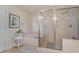 Bright bathroom showcasing a luxurious soaking tub and a glass-enclosed shower at 265 Venice Way # 1-201, Myrtle Beach, SC 29577