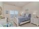 Cozy bedroom with soft lighting, charming decor, and a serene atmosphere by the window at 265 Venice Way # 1-201, Myrtle Beach, SC 29577