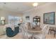 Cozy dining area with elegant decor and a view into the living room at 265 Venice Way # 1-201, Myrtle Beach, SC 29577