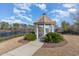 Charming lakeside gazebo with a pathway surrounded by lush greenery at 265 Venice Way # 1-201, Myrtle Beach, SC 29577