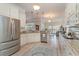 Spacious white kitchen with stainless steel appliances, granite countertops, and an open view to the dining area at 265 Venice Way # 1-201, Myrtle Beach, SC 29577