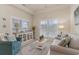 Comfortable living room featuring neutral paint, decor, large bright windows, and plush seating at 265 Venice Way # 1-201, Myrtle Beach, SC 29577
