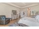 Inviting bedroom featuring a tray ceiling, wood floors, and a peaceful, coastal style at 265 Venice Way # 1-201, Myrtle Beach, SC 29577