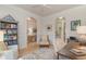 Charming office space filled with bookshelves and large arched doorway to other rooms at 265 Venice Way # 1-201, Myrtle Beach, SC 29577
