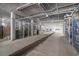 Secured parking garage featuring caged storage units, ample space, and bright lighting at 265 Venice Way # 1-201, Myrtle Beach, SC 29577