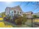 View of a home's back exterior with a fenced yard and covered patio at 286 Willow Bay Dr., Murrells Inlet, SC 29576