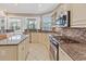 Bright kitchen with stainless steel appliances, granite counters and tile backsplash at 286 Willow Bay Dr., Murrells Inlet, SC 29576