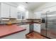 Bright kitchen featuring stainless steel appliances, white cabinetry, and laminate countertops at 356 Boxcar Dr., Longs, SC 29568