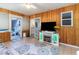 Spacious sunroom featuring access to the backyard, complete with a fireplace, and stylish wood paneled walls at 356 Boxcar Dr., Longs, SC 29568