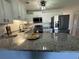 Well-appointed kitchen featuring granite countertops, white cabinets, and stainless steel appliances at 3700 Golf Colony Dr. # 26G, Little River, SC 29566