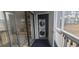 Convenient screened in porch with laundry room and outdoor views through sliding glass door at 3700 Golf Colony Dr. # 26G, Little River, SC 29566