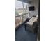Enjoy this screened-in porch with outdoor seating, an outdoor tv and community views at 3700 Golf Colony Dr. # 26G, Little River, SC 29566