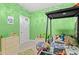 bedroom featuring custom-built bunk bed, neutral carpet and pale green accent walls at 414 Antietam Place, Little River, SC 29566