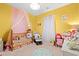 A Bedroom featuring a baby crib, neutral walls and carpet, and a window with natural light at 414 Antietam Place, Little River, SC 29566