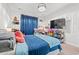 Comfortable bedroom with blue accents, a plush bed, and ample natural light, creating a cozy atmosphere at 414 Antietam Place, Little River, SC 29566