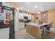 Modern kitchen featuring white cabinets, stainless steel appliances, and a center island with seating at 414 Antietam Place, Little River, SC 29566