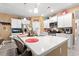 Bright kitchen featuring white cabinets, stainless steel appliances, and a spacious center island at 414 Antietam Place, Little River, SC 29566