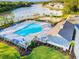 Aerial view of a community pool with lounge chairs and lush landscaping at 414 Antietam Place, Little River, SC 29566