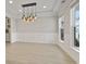 Elegant dining room featuring modern lighting, wainscoting, and large windows at 482 Noah Ave., Myrtle Beach, SC 29579