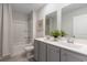 Modern bathroom featuring a double sink vanity, tub with shower, and neutral color palette at 6063 Forest Dell Ct, Myrtle Beach, SC 29579