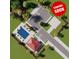 Aerial view of future home and community pool with parking, lush landscaping and greenery at 621 Woodside Dr., Conway, SC 29526