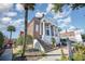 Historic building with columns and front stairs, surrounded by landscaping and greenery at 621 Woodside Dr., Conway, SC 29526