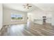 Bright living room featuring wood-look floors and a large picture window overlooking the backyard at 621 Woodside Dr., Conway, SC 29526