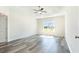 Spacious main bedroom featuring tray ceilings, a ceiling fan, and a large window at 621 Woodside Dr., Conway, SC 29526
