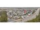 Comprehensive aerial view of the neighborhood, highlighting the townhomes, ponds, and access to main roads at 650 Wilshire Ln., Murrells Inlet, SC 29576